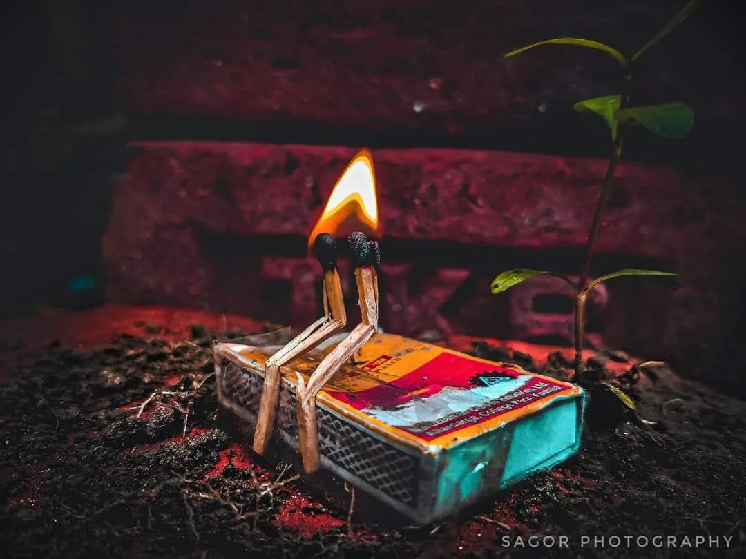 Spark: One match, one flame, the warm glow of a matchbox.