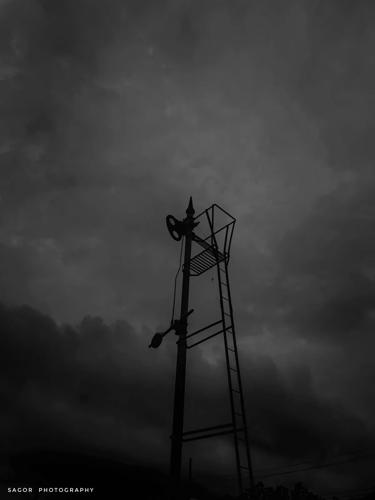 Tower: A lone tower fading into the mist.